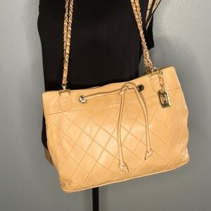 Vintage Chanel bag. Gorgeous, lamb skin quilted, double chain. Gold tag, holo
